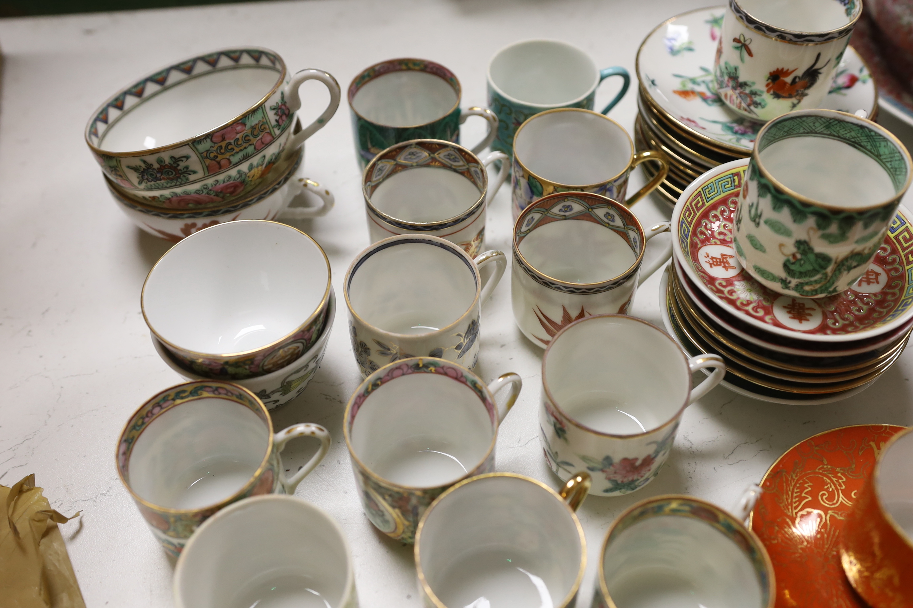 A group of Chinese enamelled porcelain coffee cups and saucers, and similar petal lobed bowls, mid 20th century